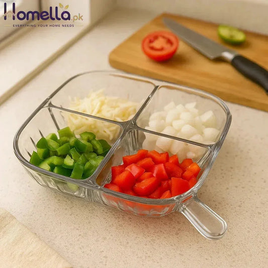 Glass compartmentalized dish with chopped vegetables on a kitchen counter
