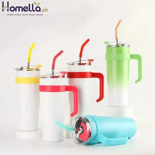 Set of colorful tumblers with handles and straws on a white background