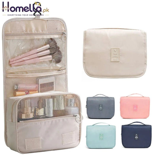 Cosmetic bag with makeup items and additional bags in different colors on a white background