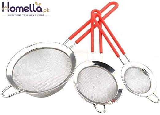 Set of three metal strainers with red handles on a white background