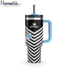 Beanie cup with black and white striped design and blue handle on a white background