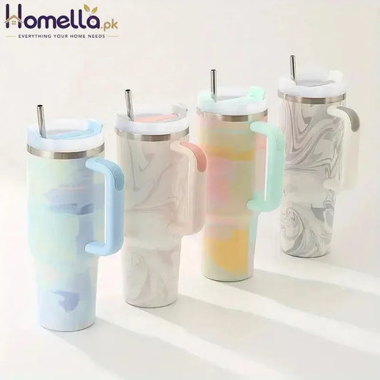Set of five insulated travel mugs with handles and straws on a white background
