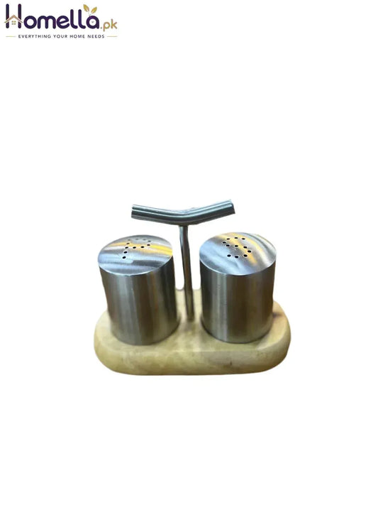 Stainless steel salt and pepper shakers on a wooden stand with a white background