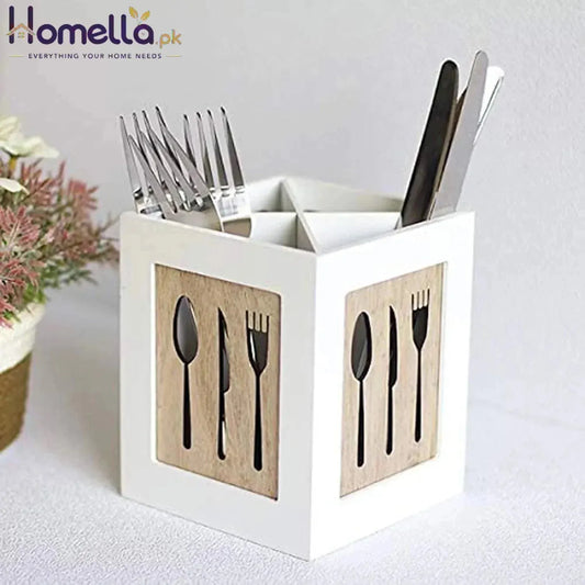 White utensil holder with cutlery on a light background