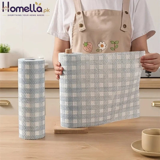Person holding a checkered fabric basket with a cylindrical fabric roll on a wooden surface.