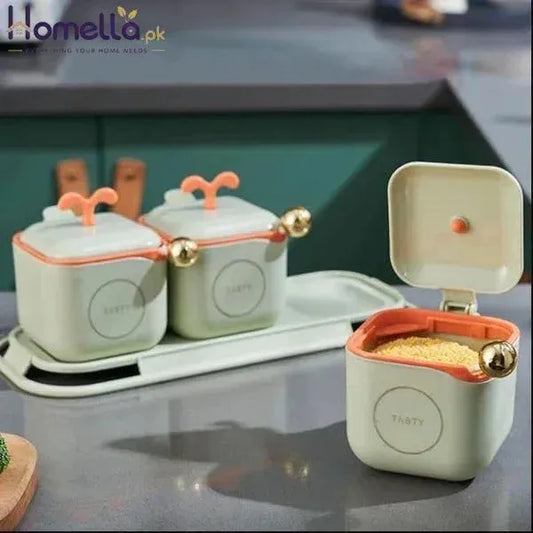 Set of ceramic containers with lids on a kitchen counter