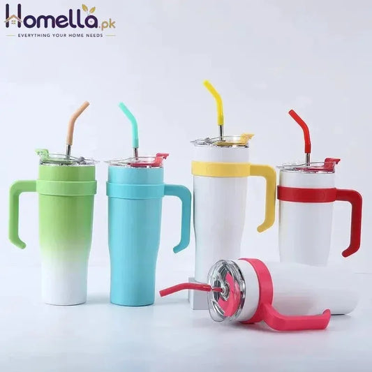 Set of colorful tumblers with handles and straws on a white background