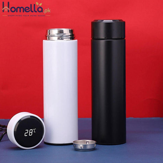 Two thermos bottles, one white and one black, with a digital thermometer on a red and blue background.
