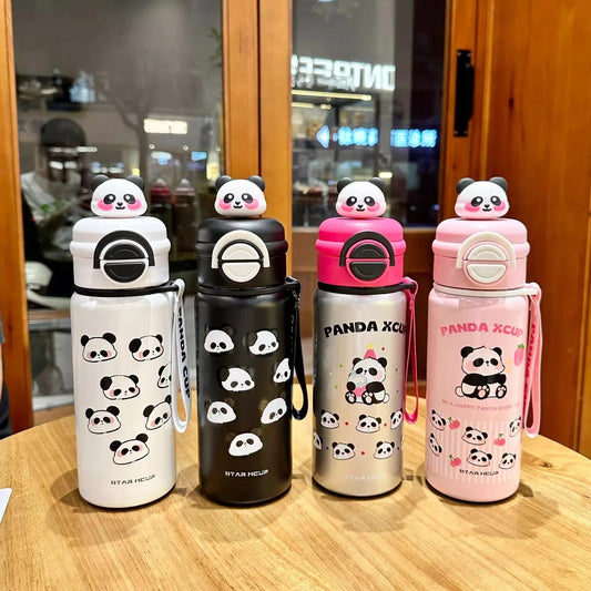 Four panda-themed water bottles on a wooden table with a blurred indoor background.