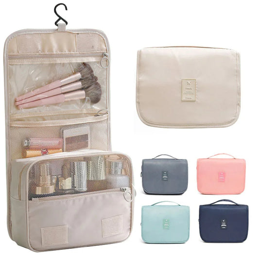 Cosmetic bag with makeup items and additional bags in different colors on a white background