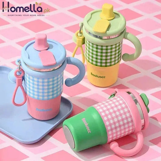 Three colorful children's sippy cups on a pink checkered background