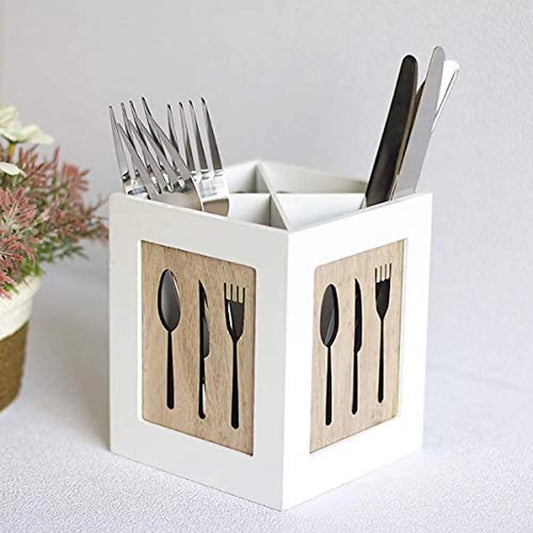 White utensil holder with cutlery on a light background